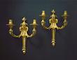 A fine pair of Louis XVI gilt bronze two-light wall-lights